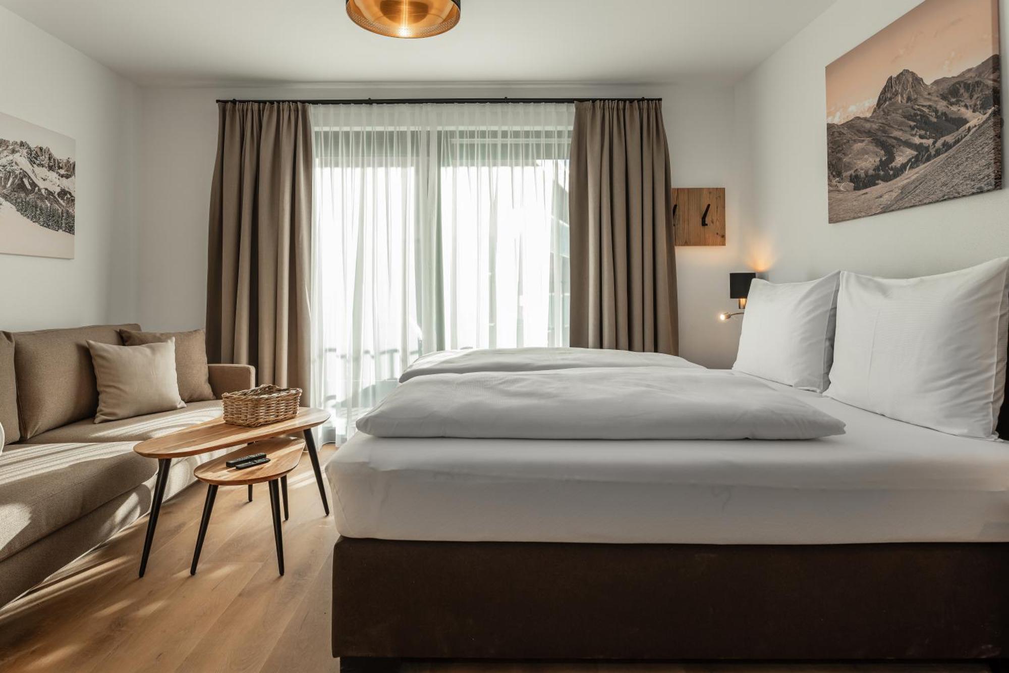 Alpenparks Hotel & Apartment Taxacher Кирхберг Номер фото
